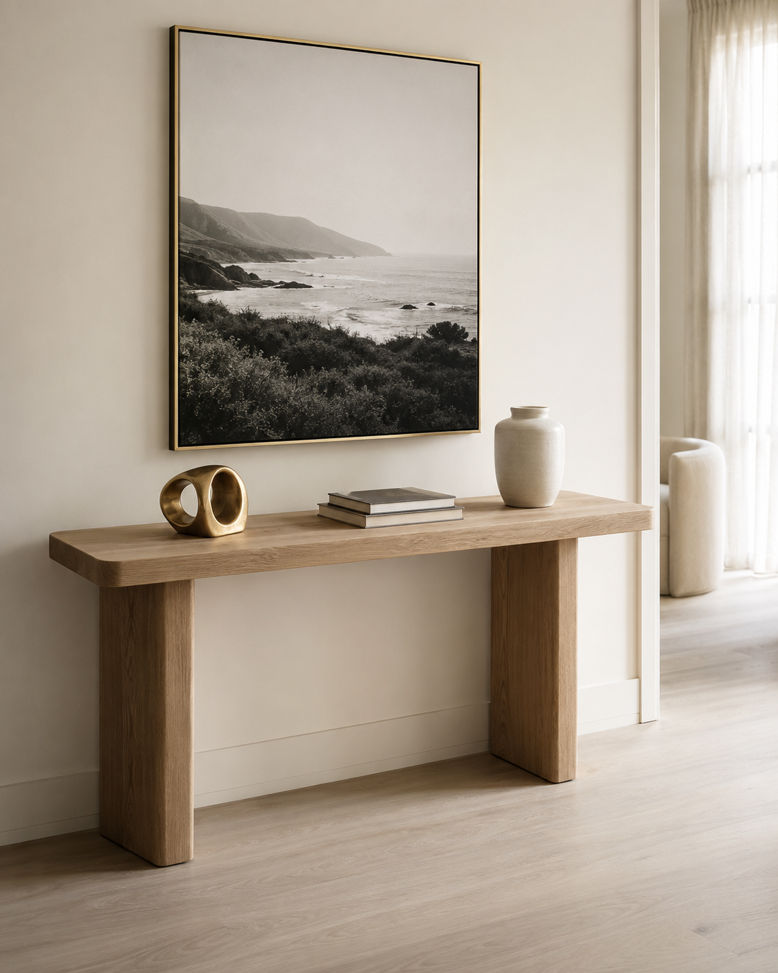 Hallway console styled with porcelain wall art, gold sculpture and ceramic vase
